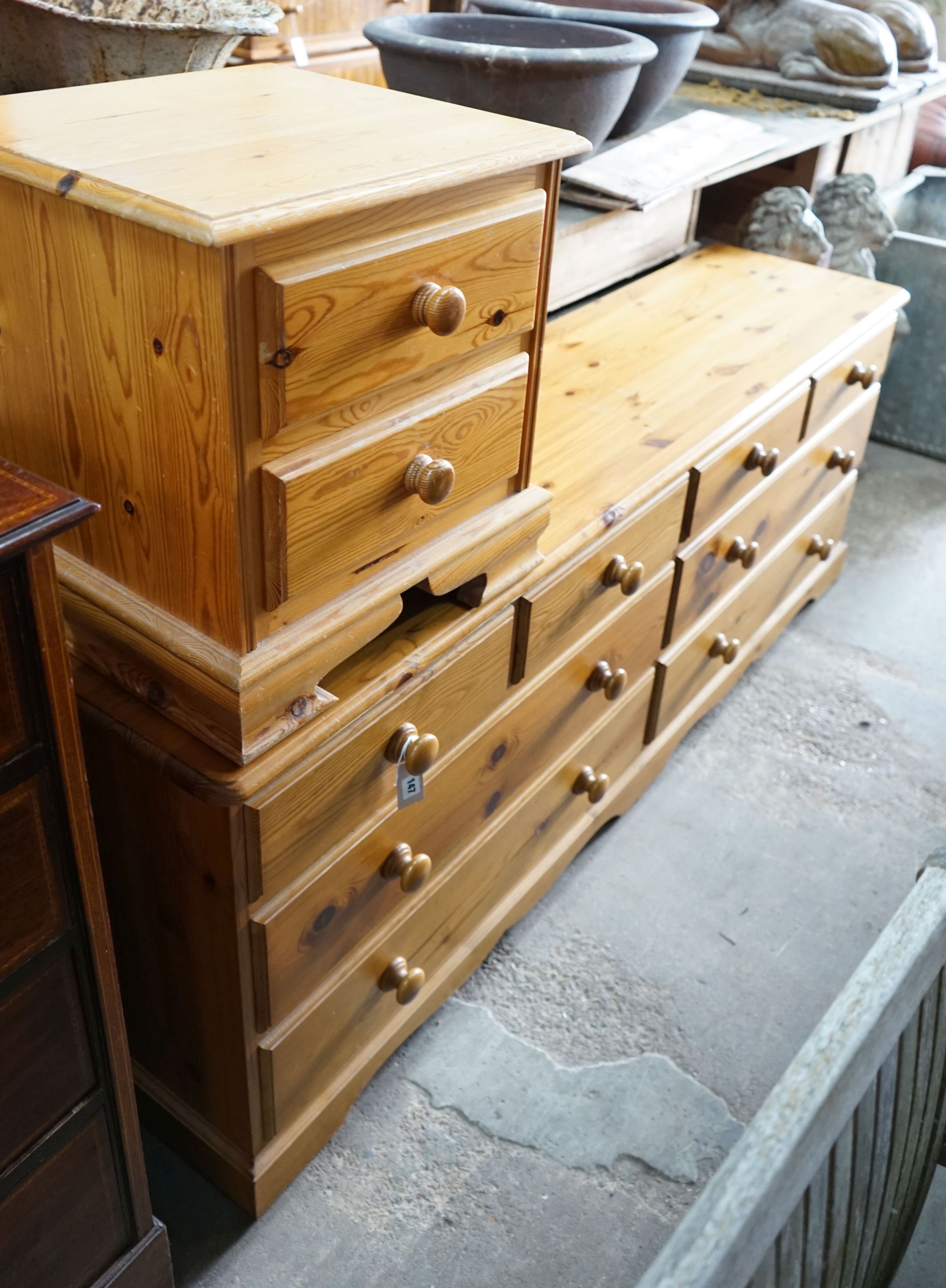 A modern pine double chest, width 192cm, depth 44cm, height 71cm and a similar two drawer bedside chest